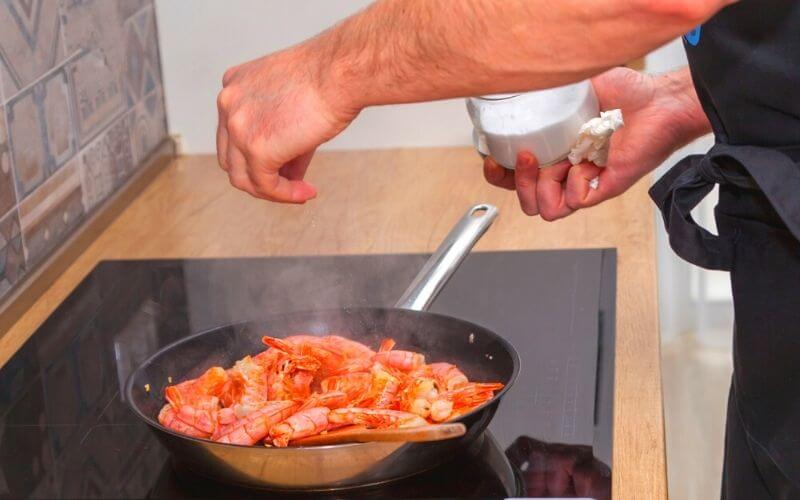 cooking shrimp in a pan