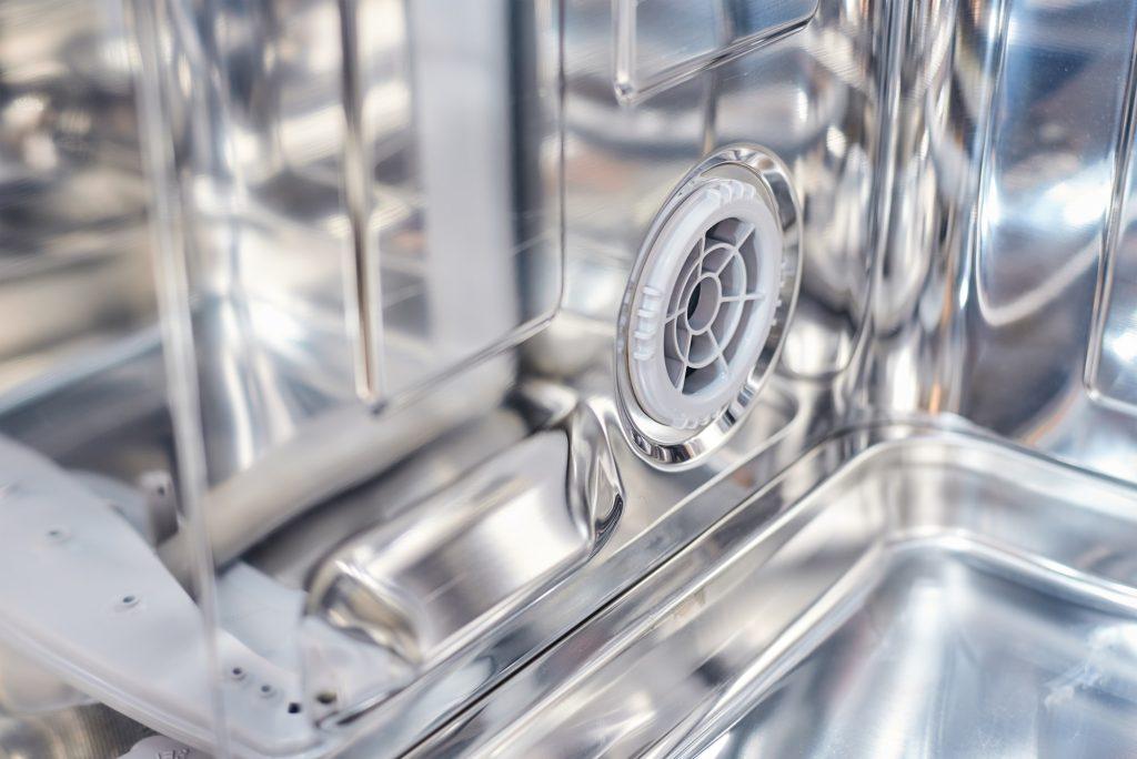 a dishwasher machine filter close up. Domestic kitchen appliance parts