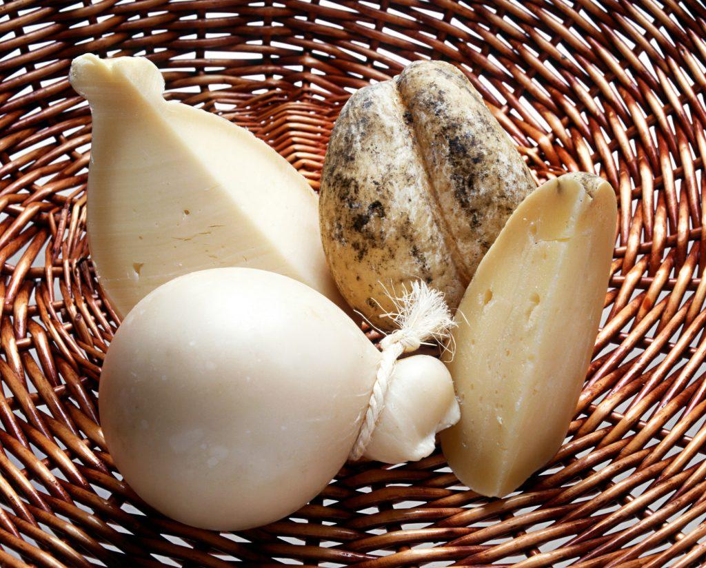 Basket of fresh sliced and whole Provolone cheese