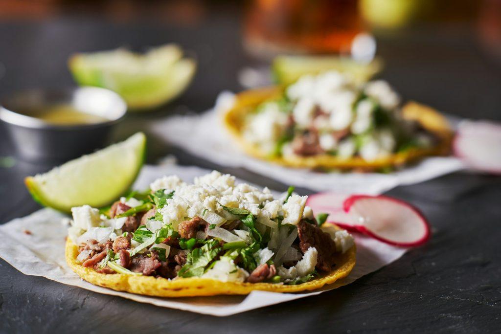 carne asada mexican tacos with crumbled queso fresco cheese