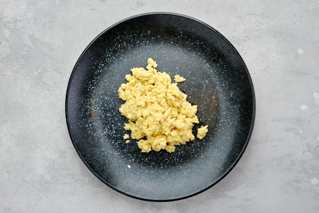 Top view of classic scrambled eggs on a plate.